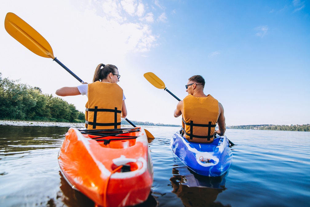 couple together kayaking river