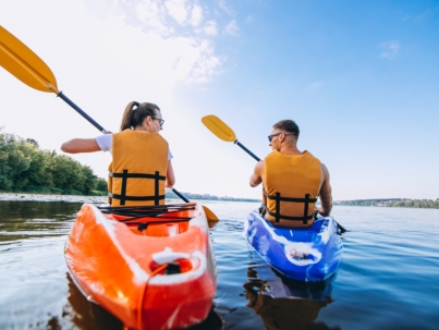 couple together kayaking river
